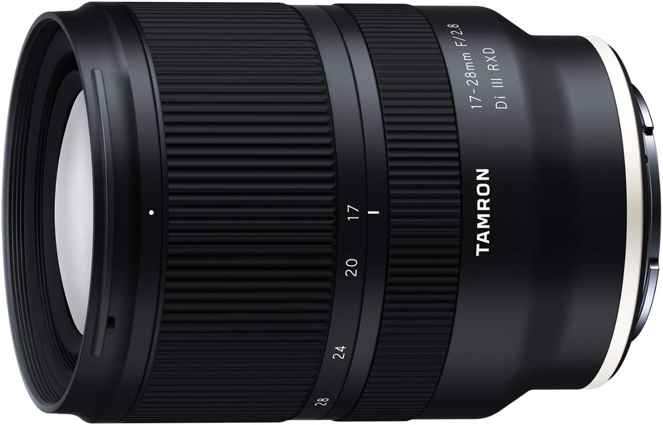 Close-up of a Tamron 17-28mm f/2.8 camera lens with a black body and white markings.