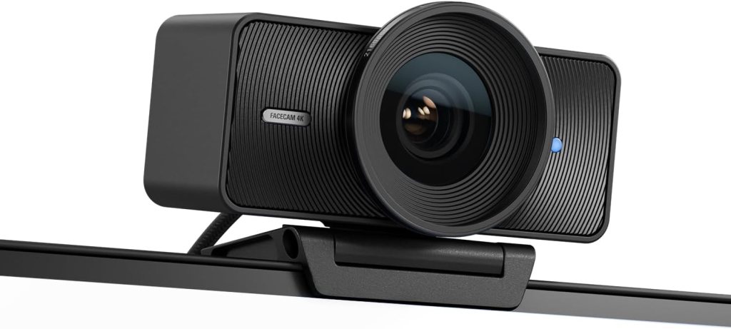 A black Elgato Facecam 4K webcam mounted on a monitor, showcasing a sleek and modern design with a prominent lens.