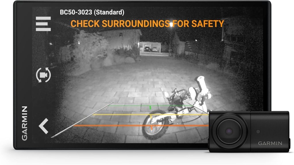 Night vision backup camera display showing surroundings with guidelines and a connected camera.