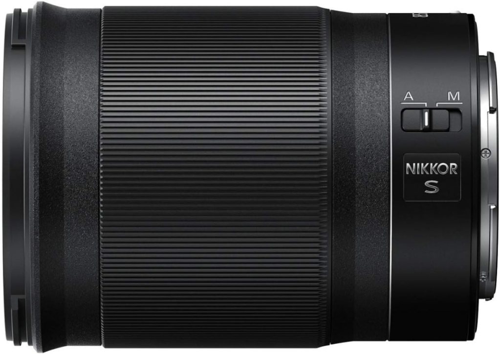 Side view of the NIKKOR Z 85mm f/1.8 S lens, showcasing its sleek design and textured grip.