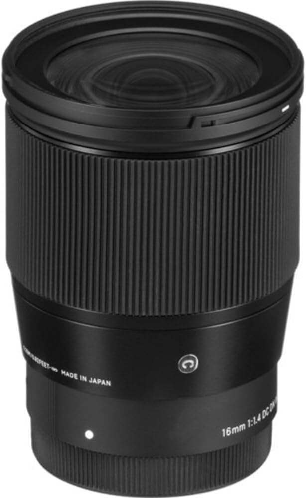 Close-up view of a Sigma 16mm f/1.4 DC DN lens showcasing its design and markings.