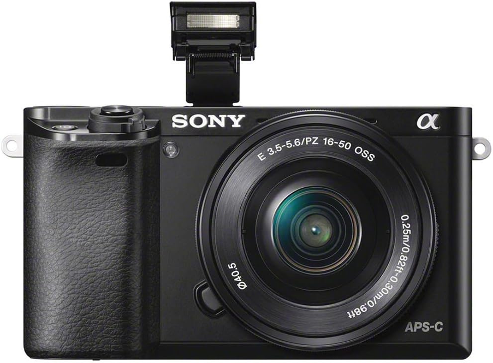 A Sony A6000 camera with a retractable lens and pop-up flash, showcasing its compact design and controls.