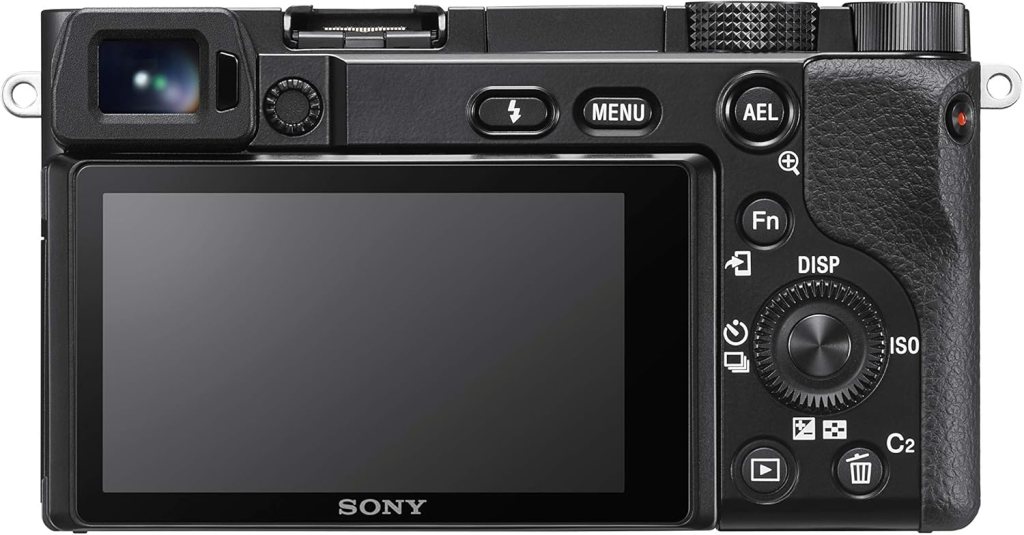 A top view of the Sony a6100 camera, showcasing its electronic viewfinder, control buttons, and LCD screen.