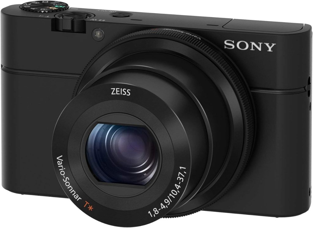 A Sony RX100 III camera featuring a sleek black design, equipped with a Zeiss Vario-Sonnar lens, showcasing advanced compact features for photography and videography.
