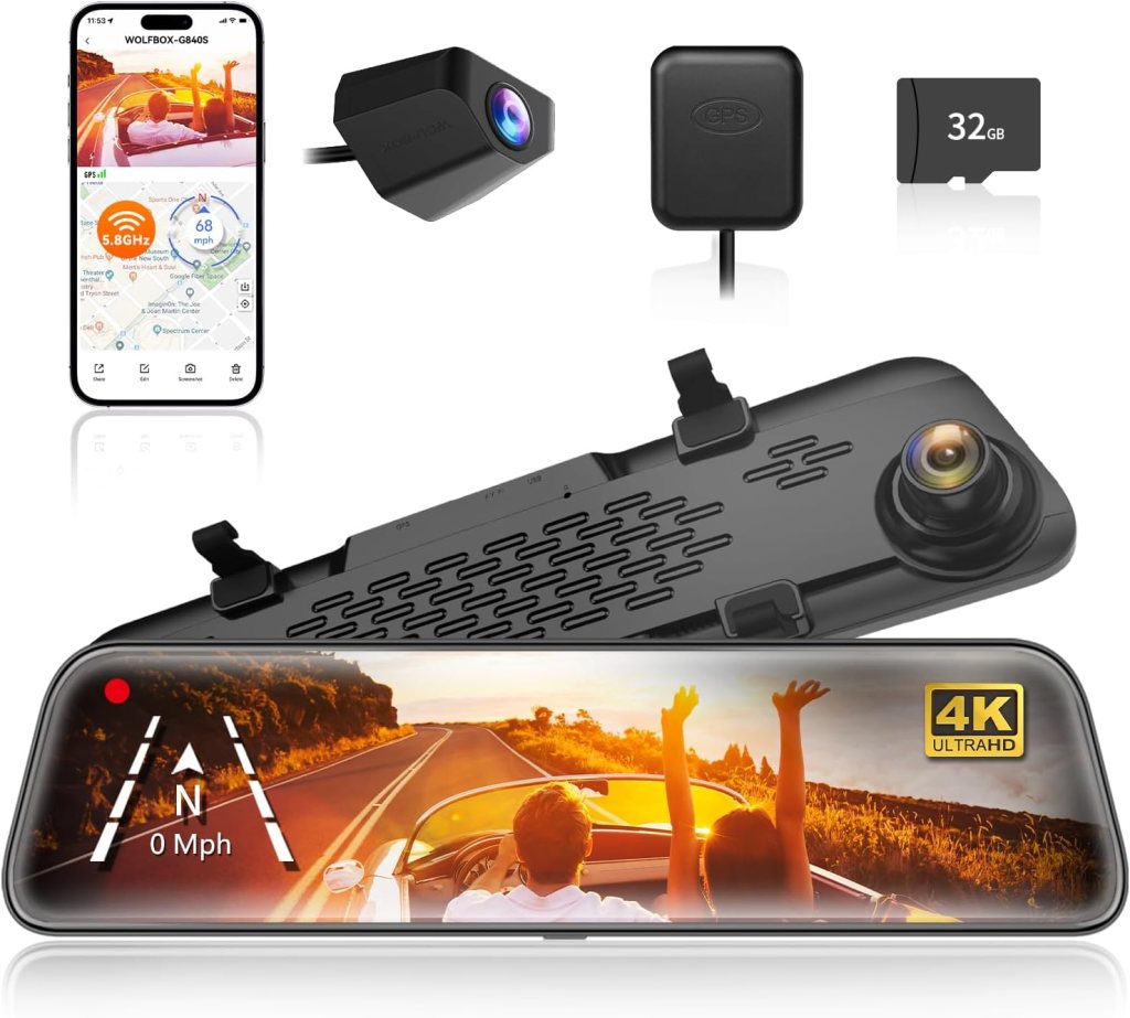 A Wolfbox G840S rearview mirror camera system, featuring a large touchscreen display, a rear camera, GPS module, and a 32GB memory card, all positioned against a backdrop of a scenic road.