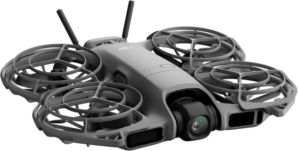 A grey drone featuring propeller guards and antennas, designed for enhanced stability and safety during flight.