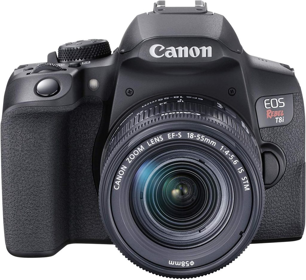 A Canon EOS Rebel T8i digital camera with an 18-55mm zoom lens, shown from the front.
