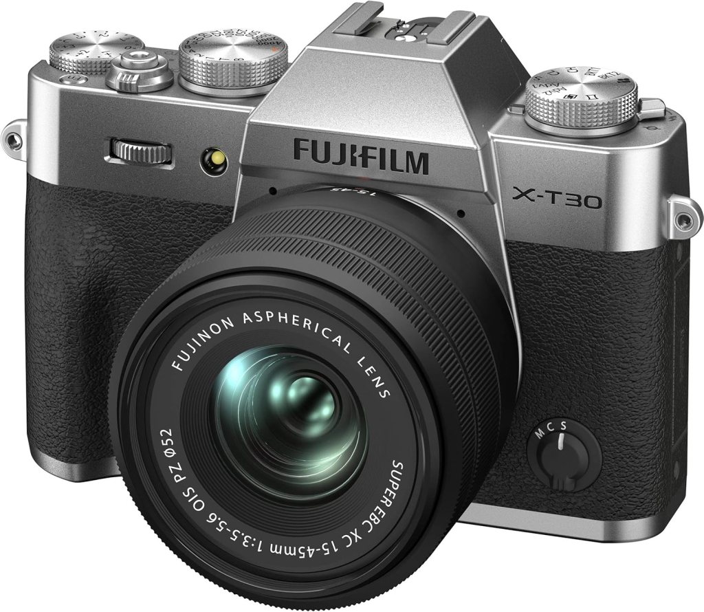 Fujifilm X-T30 mirrorless camera with a black grip and silver body, featuring a Fujinon 15-45mm aspherical lens.