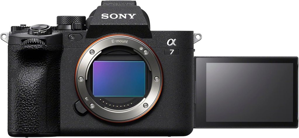 Front view of a Sony Alpha 7 mirrorless camera, featuring an E-mount lens mount and a tiltable LCD screen on the side.
