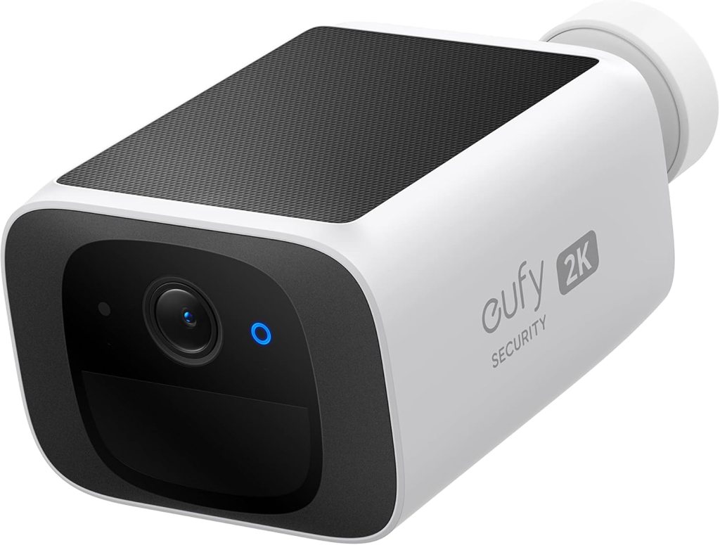A close-up view of a Eufy 2K security camera featuring a sleek white design with a black front panel and blue indicator light.