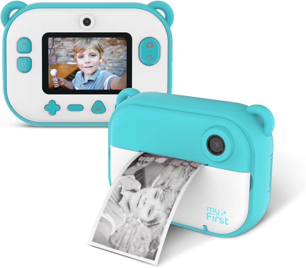 A compact children's camera printer in turquoise, showing a small photo print of a boy smiling and holding an ice cream cone.