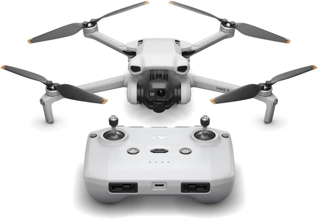 A DJI Mini 3 drone with its remote control, showcasing a compact design and four propellers.