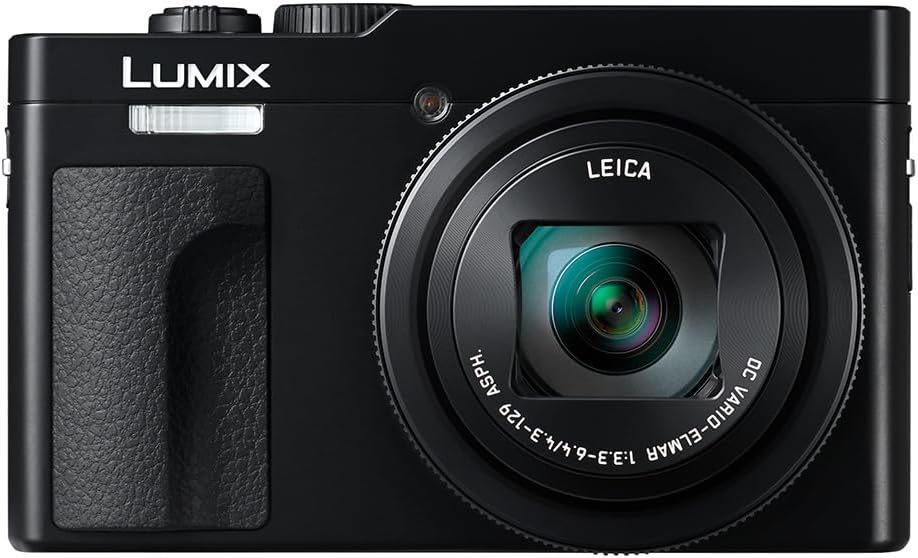 A compact black camera with a Leica lens, featuring a textured grip and the Lumix logo on the front.