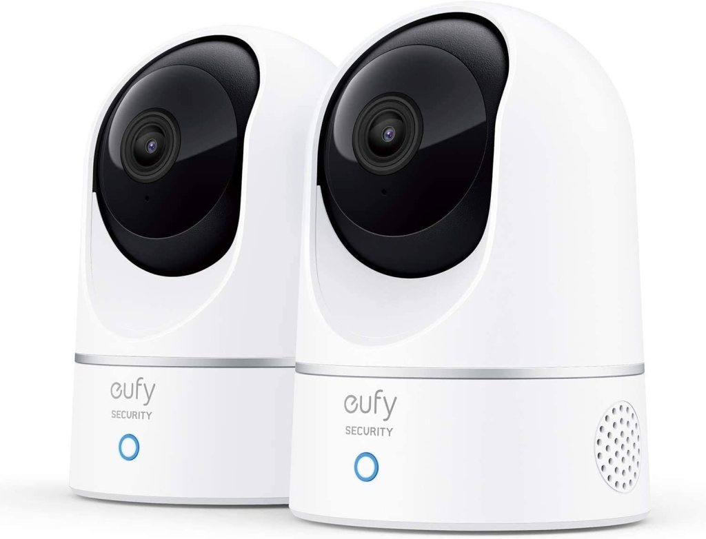 Two Eufy security cameras in white housing with black lenses, designed for home surveillance.