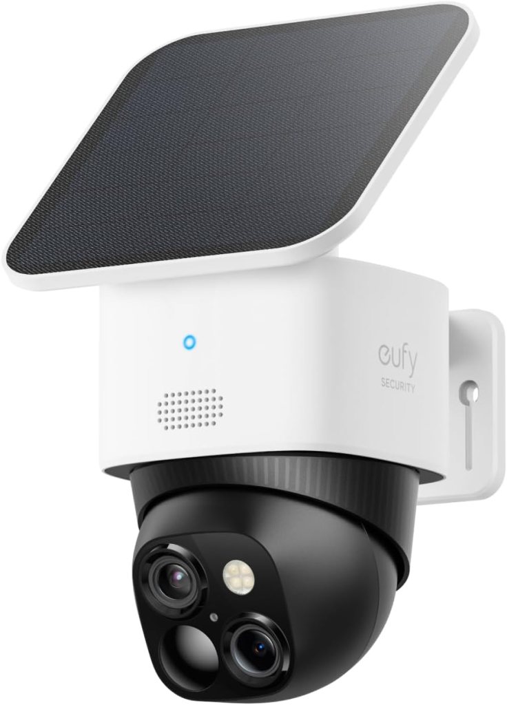 A Eufy Security camera with a solar panel, featuring a black spherical camera housing with dual lenses and a light. The device is mounted on a wall.