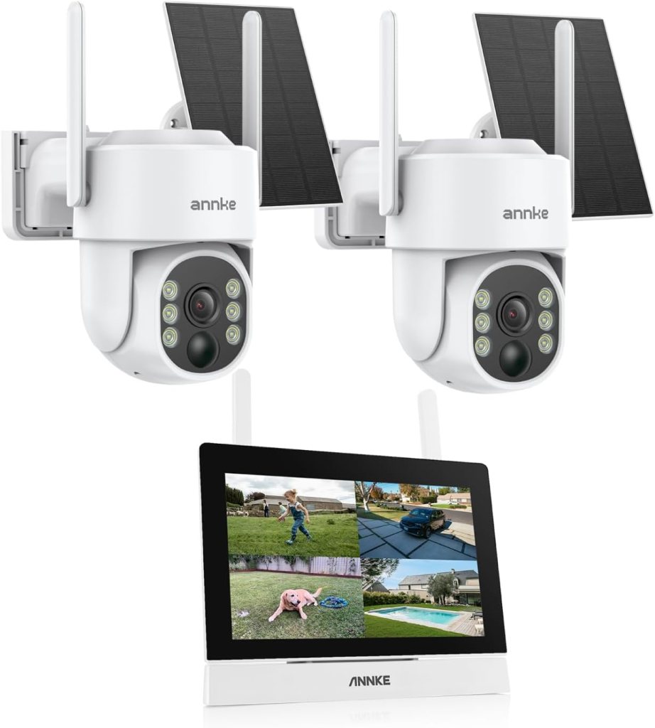 Two solar-powered security cameras mounted on a wall, accompanied by a display monitor showing four live video feeds.