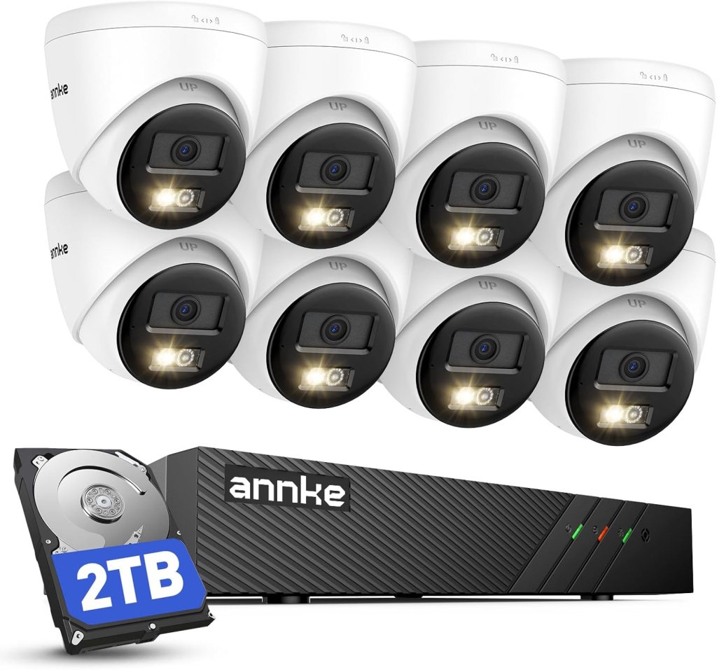 A security camera system featuring eight white dome cameras with built-in lights and a black DVR unit labelled '2TB' from the brand Annke.
