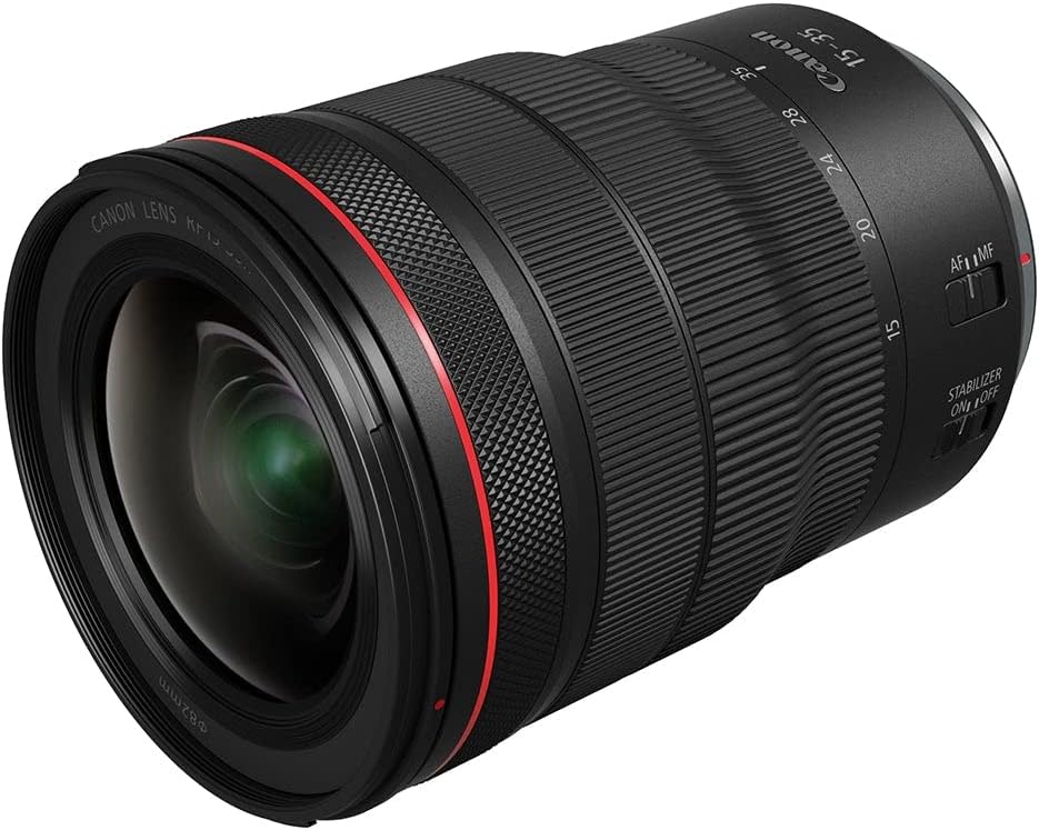 A Canon RF 15-35mm camera lens with a black and red design, featuring focus and stabilisation switches.