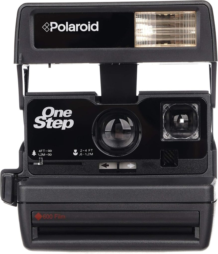 A Polaroid One Step instant camera featuring a black body, lens, and built-in flash, designed to use 600 film.