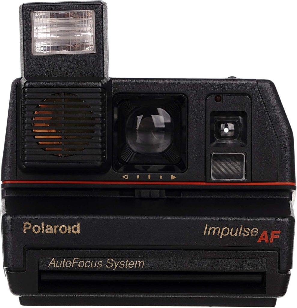 Front view of a Polaroid Impulse AF instant camera with a flash, autofocus lens, and ejector slot for photos.